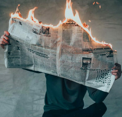 What is a Winning Attitude - burning news paper